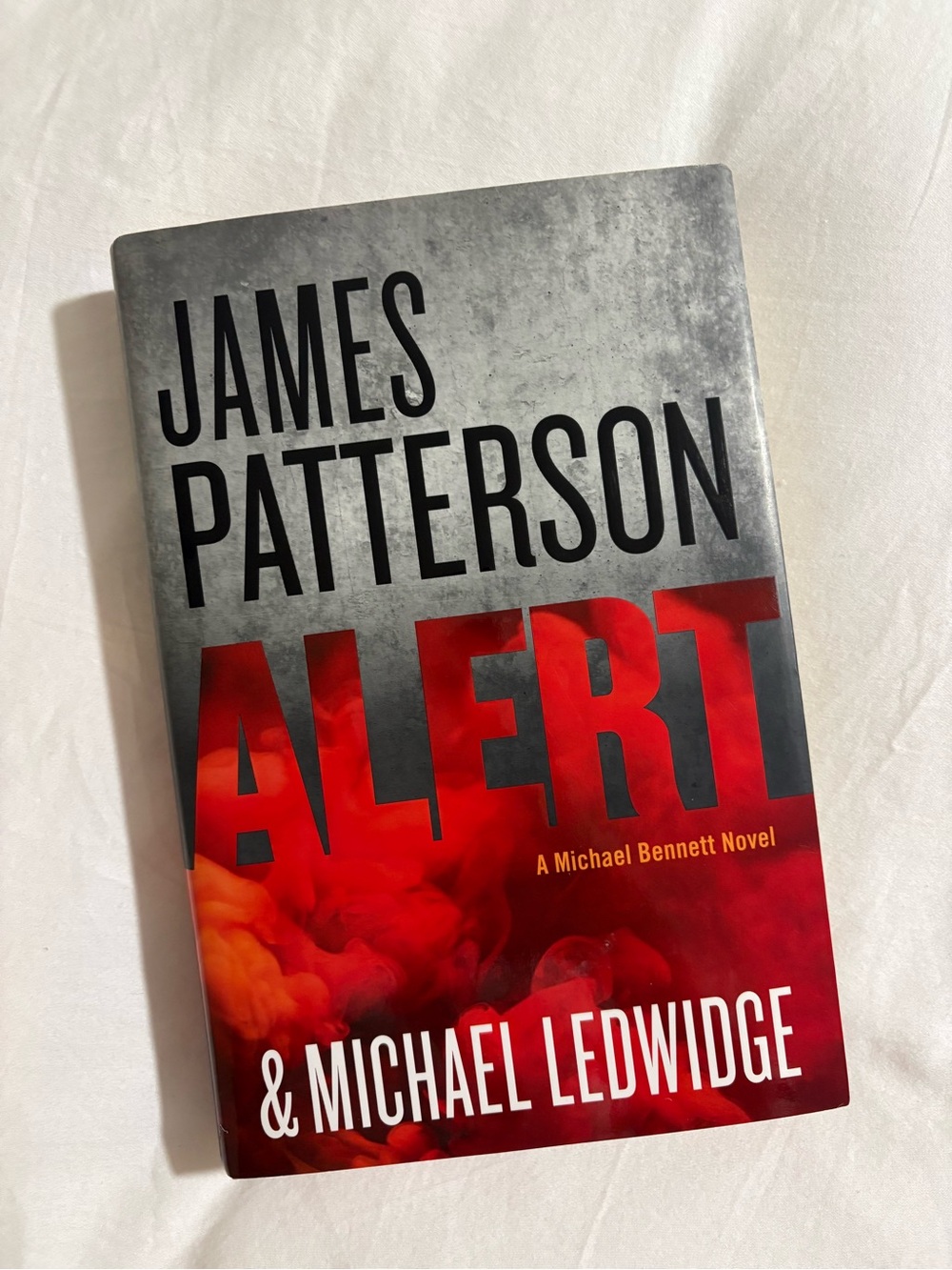 James Patterson Alert - Red and Gray Hardcover Novel
